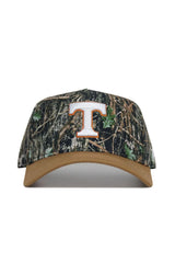 The No Rivals Tennessee Camo Hat – Explorer Edition features a tan brim, bold white and orange "T" logo, high-quality cotton construction, and an adjustable snapback for the perfect fit.