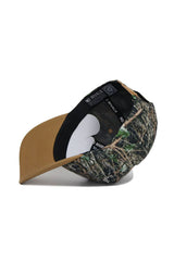 The Wake Forest Camo Hat - Explorer Edition by No Rivals is shown upside down, displaying its brown brim underside and black interior with NO RIVALS on the band. This snapback features a structured fit for lasting comfort.