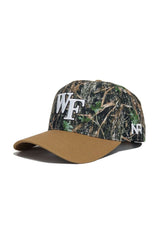 The Wake Forest Camo Hat - Explorer Edition by No Rivals features a brown brim, camo crown, large white WF on front, small NR on the side, and is crafted from quality cotton for a structured fit.