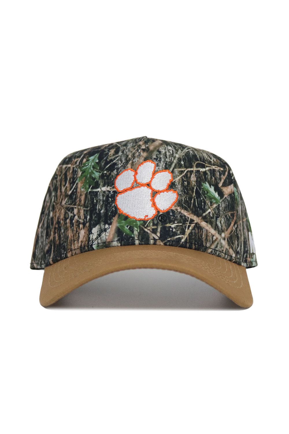 The No Rivals Clemson Camo Hat - Explorer Edition features a tan brim, orange-outlined white paw print logo, high-quality cotton construction, and an adjustable snap back for the perfect fit.