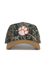 The No Rivals Clemson Camo Hat - Explorer Edition features a tan brim, orange-outlined white paw print logo, high-quality cotton construction, and an adjustable snap back for the perfect fit.