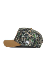 The No Rivals Clemson Camo Hat - Explorer Edition features a woodland camo pattern, brown brim, white embroidered NR initials on the side, high-quality cotton fabric, and an adjustable snap back for comfort.