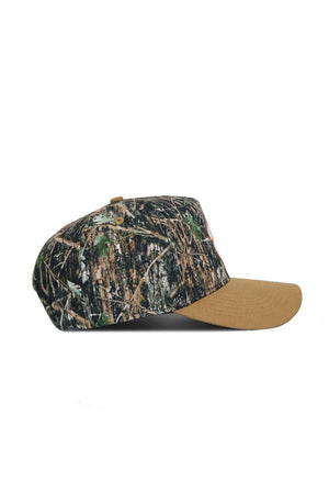 The No Rivals Clemson Camo Hat - Explorer Edition is shown from the side, featuring a camo cotton crown, solid tan brim, snapback closure, and displayed on a white background.