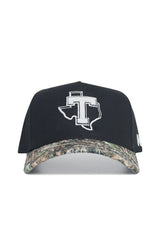 The No Rivals Tarleton State Camo Hat - Trailblazer Edition features a black snapback design, camouflage brim, white Texas outline with a big T on the front, and high-quality cotton construction for a structured, comfortable fit.