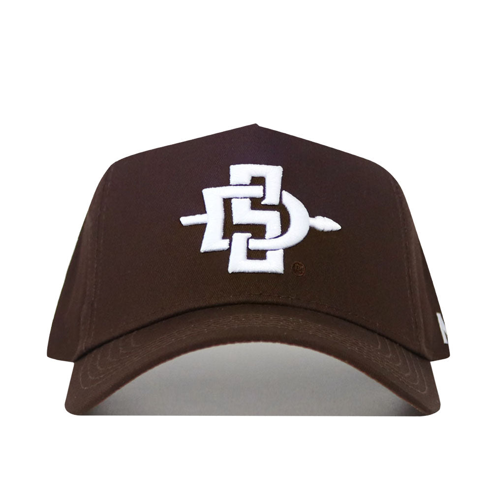 The San Diego State Americano Hat is a brown cap with a white embroidered interlocking SD logo and spear, representing San Diego State University. This officially licensed hat features a structured fit for style and comfort.