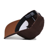 The San Diego State Americano Hat is shown upside down, revealing its inside with a black NO RIVALS sweatband, an adjustable strap with a silver buckle, and a structured fit for lasting style.
