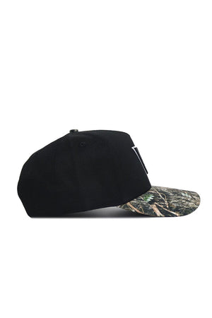 The No Rivals Vanderbilt Camo Hat - Trailblazer Edition features a black crown, curved camouflage brim, and premium cotton construction, displayed in a side profile view on a white background.