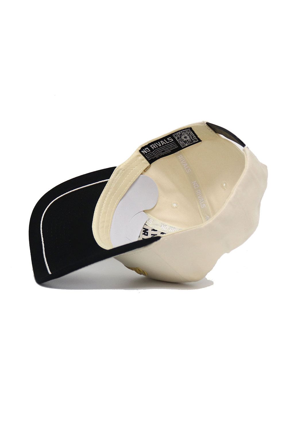 The Wake Forest ALOYO Hat by No Rivals is a cream-colored cap with a black underside brim, "NO RIVALS" on the inner band, high-quality cotton, and a snapback for comfort.