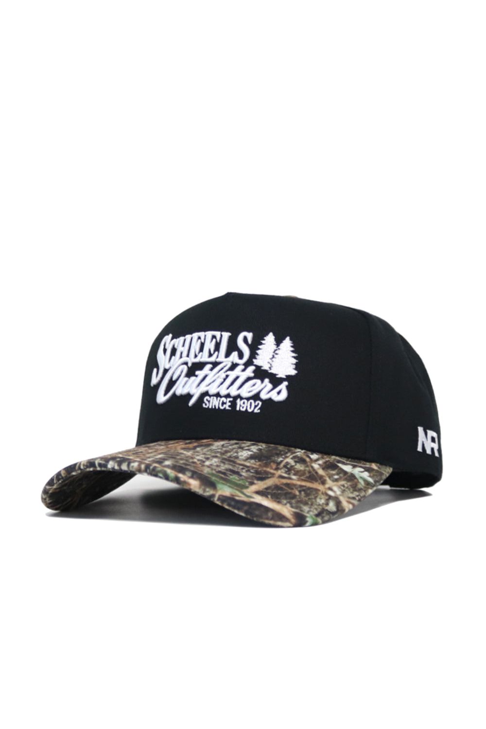 The Scheels Camo Trailblazer Hat is a black snapback with white embroidered text and two pine trees on the front, a camo-pattern brim, and a small white AF logo on the side. Made from high quality cotton with a structured fit.