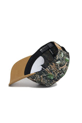 The Dallas Camo Hat - Explorer Edition by No Rivals features a green and brown camo pattern, curved brim, tan snapback, black interior lining labeled NO RIVALS, white inserts, and is crafted from high-quality cotton.