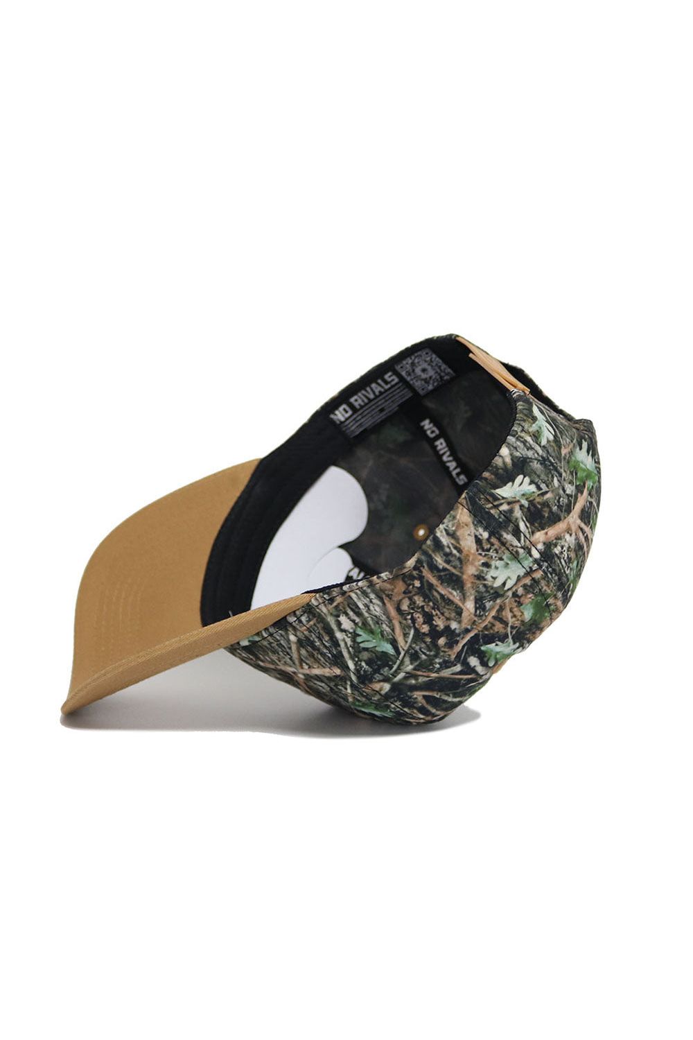 The Texas State Camo Hat - Explorer Edition by No Rivals is a structured fit camo baseball cap with a tan brim. Shown upside down, its black interior band reads NO RIVALS. Made from high-quality cotton, this snapback sits on a plain white background.
