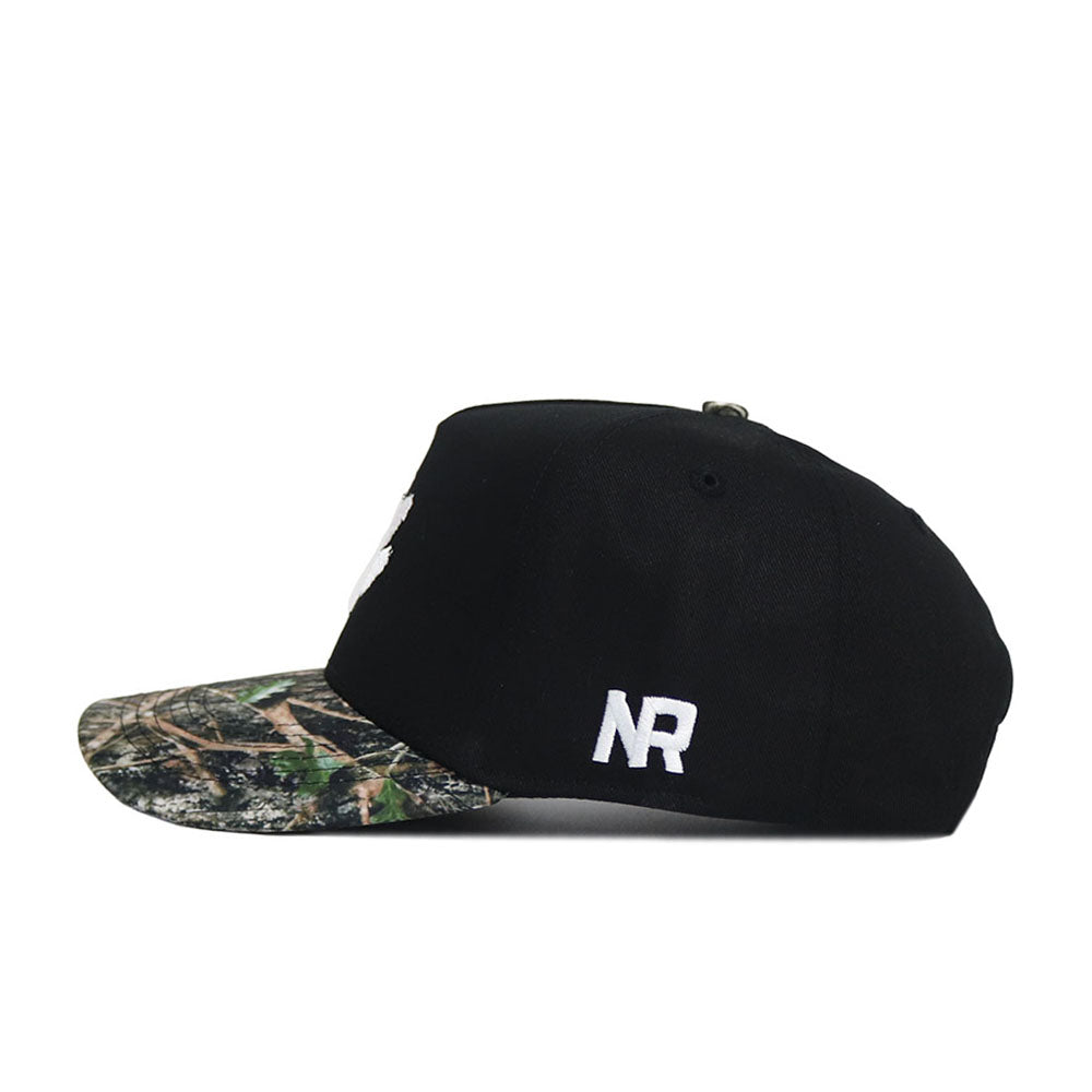 The No Rivals Clemson Camo Hat - Trailblazer Edition is a black snapback with a camo brim, crafted from quality cotton and featuring white NR initials embroidered on the side. Structured fit, shown in side view on a white background.