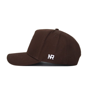 The Arizona State Americano Hat is a brown cotton baseball cap with a curved brim, shown from the side. It features white embroidered “NR” near the back and offers a comfortable, structured fit.