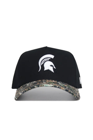 The No Rivals Michigan State Camo Hat - Trailblazer Edition is a black snapback with a white Spartan helmet logo and a camo-patterned brim, made from premium cotton for a structured fit.