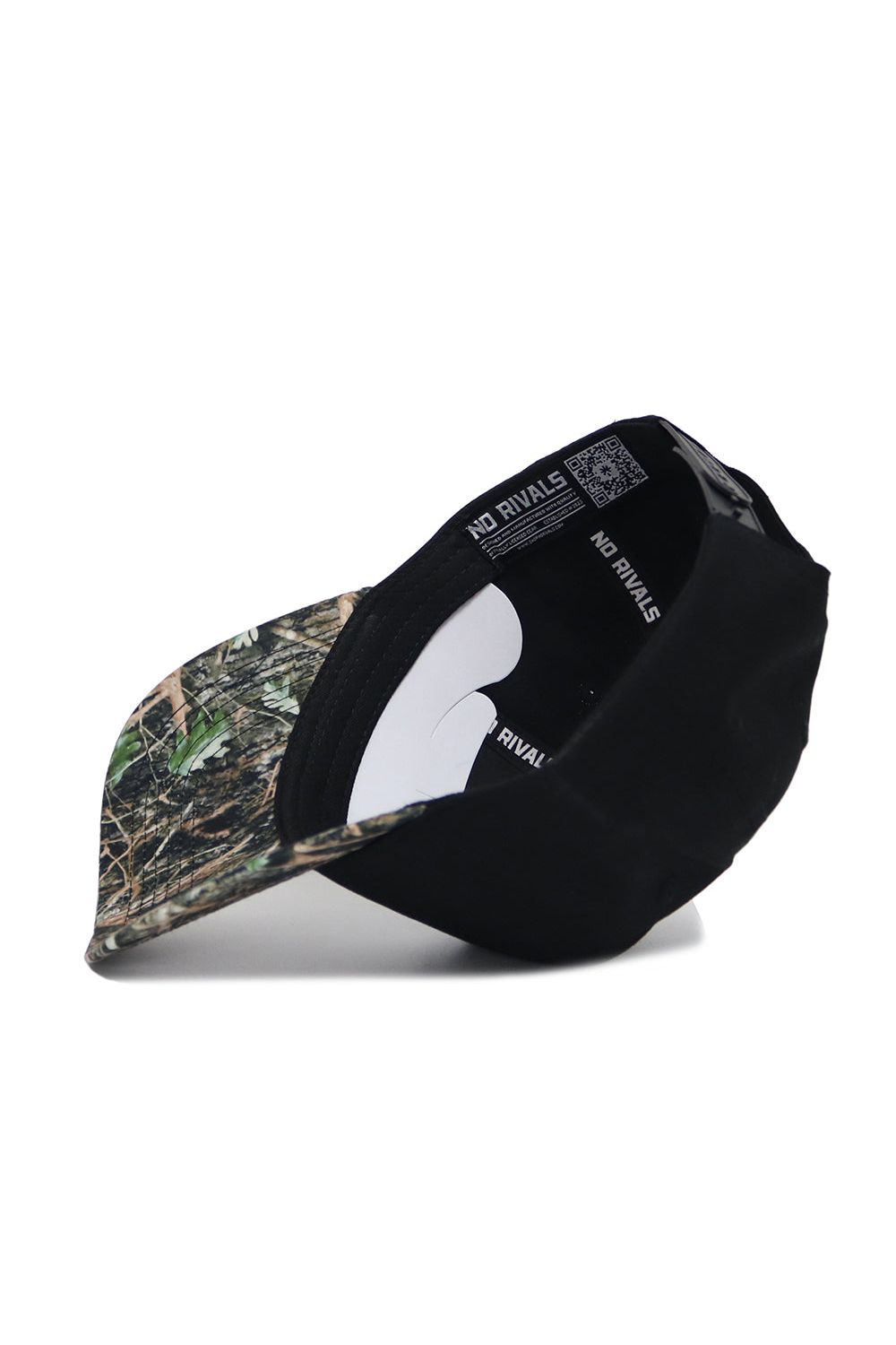 The Michigan State Camo Hat - Trailblazer Edition by No Rivals is a black, structured fit cap with a camo-patterned brim and "NO RIVALS" printed on the inner band, designed for style and comfort.