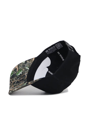 The Michigan State Camo Hat - Trailblazer Edition by No Rivals is a black, structured fit cap with a camo-patterned brim and "NO RIVALS" printed on the inner band, designed for style and comfort.