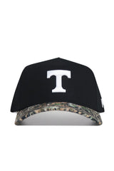 The No Rivals Tennessee Camo Hat - Trailblazer Edition is a black structured-fit baseball cap crafted from premium cotton, featuring a bold white "T" on the front and a camo-patterned brim.