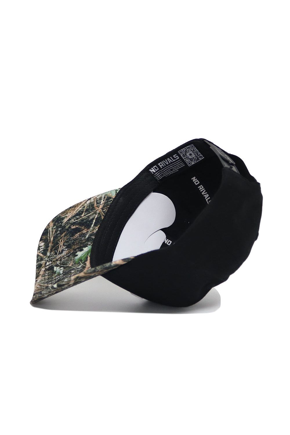 The Tennessee Camo Hat - Trailblazer Edition by No Rivals features a black structured fit with a camo brim, shown tilted to reveal "NO RIVALS" printed on the inner band. Crafted from high-quality cotton for comfort.