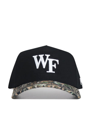 The No Rivals Wake Forest Camo Hat - Trailblazer Edition features bold white WF letters on a black crown, a camouflage-patterned bill, and a structured fit for lasting style.