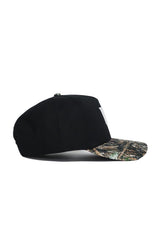 The No Rivals Wake Forest Camo Hat - Trailblazer Edition features a black crown, camouflage-patterned brim, and structured fit, displayed in side profile against a white background.
