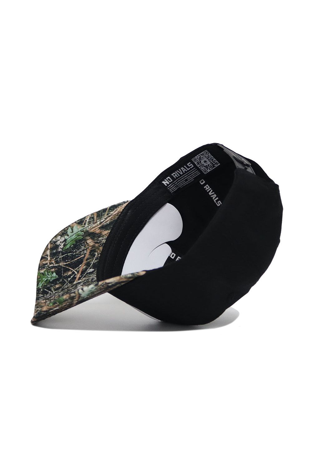 The Wake Forest Camo Hat - Trailblazer Edition by No Rivals is a black snapback with a camo-patterned brim, shown upside down to reveal its structured fit and "No Rivals" printed on the interior band.