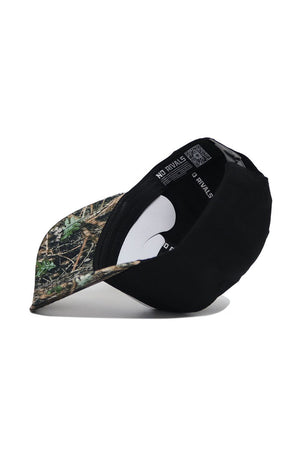 The Wake Forest Camo Hat - Trailblazer Edition by No Rivals is a black snapback with a camo-patterned brim, shown upside down to reveal its structured fit and "No Rivals" printed on the interior band.