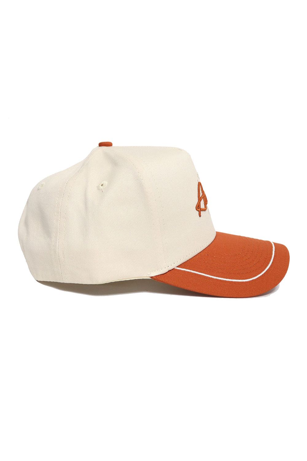 The No Rivals Austin ALOYO Hat features a cream snapback design with a burnt orange curved brim and button, white piping, an orange embroidered front design, and is crafted from high quality cotton for a structured fit.