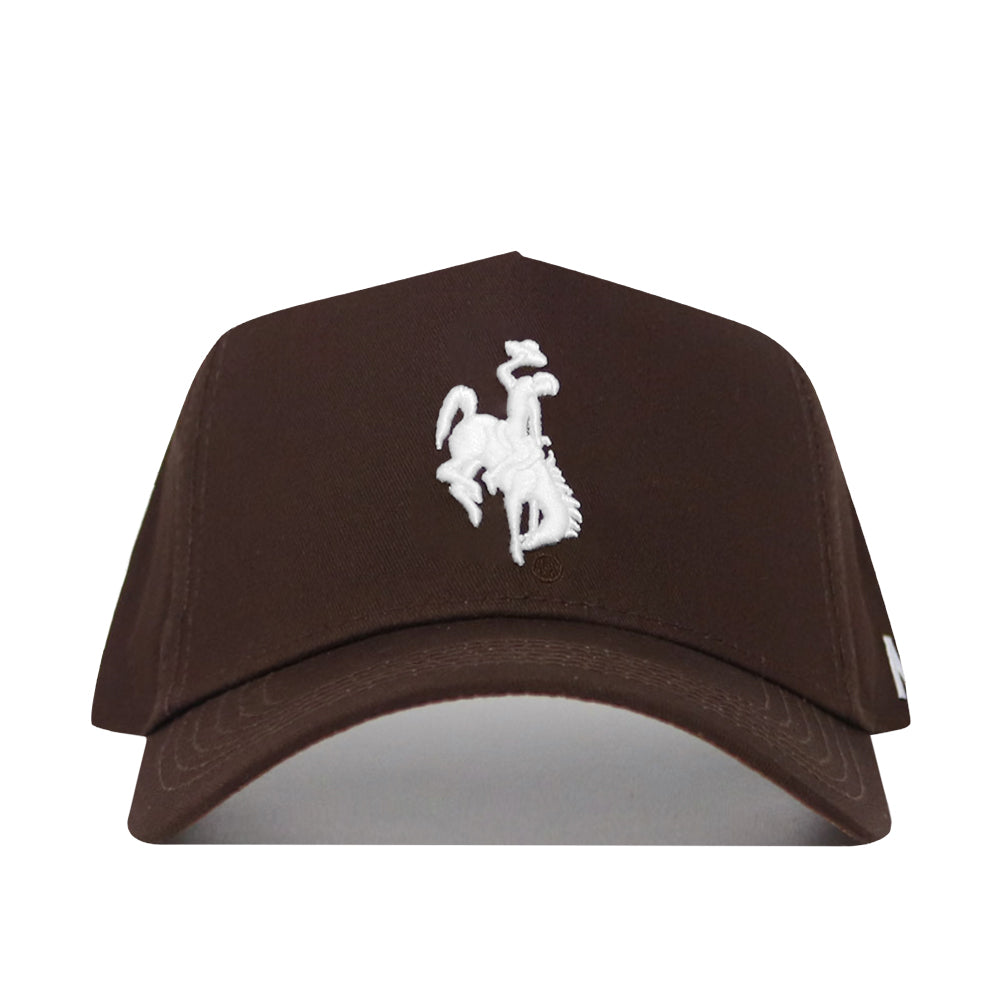 The Wyoming Americano Hat is a brown cotton baseball cap with a white embroidered cowboy riding a bucking horse logo on the front.