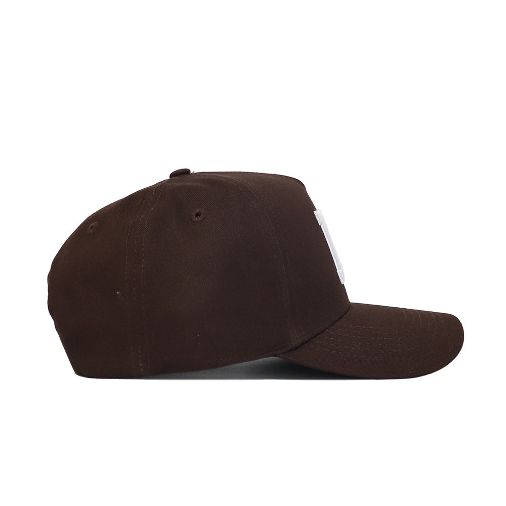 The Rutgers Americano Hat (B2B) is displayed from the side on a white background, featuring a brown cotton build, flat bill, structured fit, and distinct stitching details.