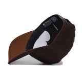 The Rutgers Americano Hat (B2B) is shown upside down, highlighting its high-quality cotton lining, brown structured brim, and interior with a black sweatband featuring white text and a QR code.