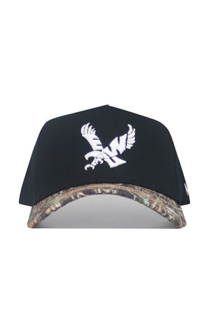 The No Rivals EWU Camo Hat - Trailblazer Edition is a black snapback crafted from premium cotton, with a structured fit, white eagle embroidery on the front, and a camo-patterned brim.