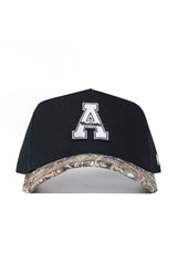 The No Rivals App State Camo Hat - Trailblazer Edition features a black cotton design, large white "A" with "Mountaineers" on the front, a snapback closure, and a camouflage brim for style and comfort.