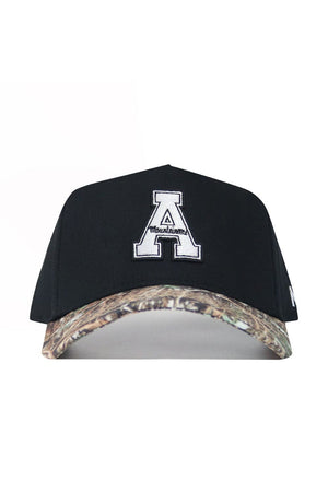 The No Rivals App State Camo Hat - Trailblazer Edition features a black cotton design, large white "A" with "Mountaineers" on the front, a snapback closure, and a camouflage brim for style and comfort.