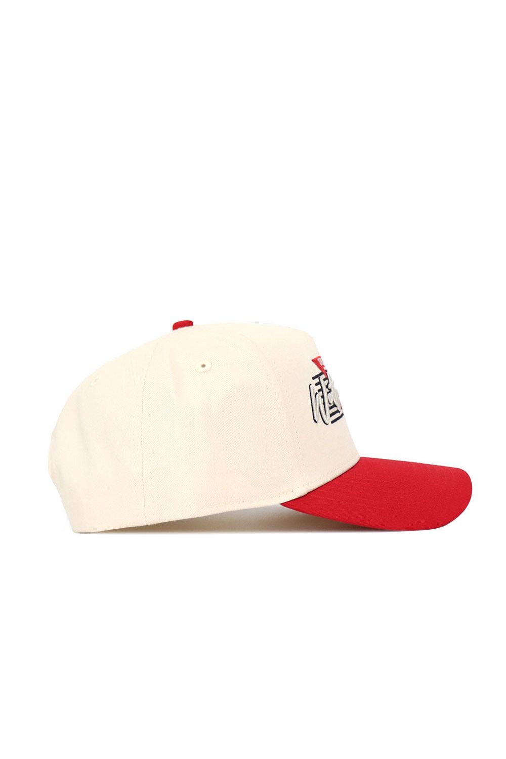 The No Rivals Western Kentucky Triangle Game Cap Hat features a structured fit, cream color, red brim and top button, and partial black and red graphic on the front panel. Shown from the side.