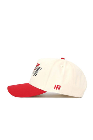 The No Rivals UNLV Triangle Game Cap Hat is cream-colored with a red bill and accents, featuring “NR” embroidered in red on the side, a black and red front graphic, and made from high-quality cotton for a structured fit.