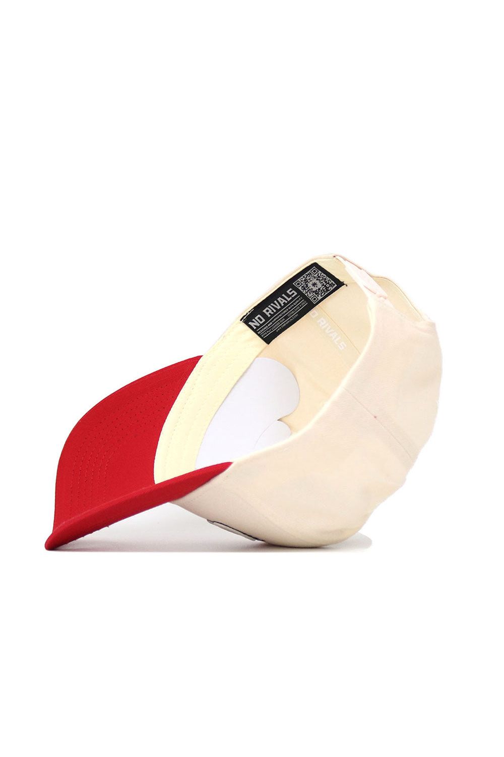 The UNLV Triangle Game Cap Hat by No Rivals is pictured upside down, showcasing its inner labels, structured fit, detailed stitching, and high-quality cotton. The hat features a beige crown and red brim in a classic snapback style.