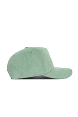 The No Rivals Kentucky Corduroy Hat - Structured in Spring Green features a flat brim, snap back closure, and embroidered eyelets on the crown, shown here from the side.