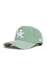 The Kentucky Corduroy Hat - Structured - Spring Green by No Rivals features a white UK logo on the front, NR stitched on the side, a curved brim, and a snapback closure for comfort. Shown on a white background.
