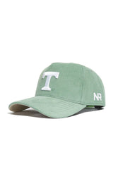 The No Rivals Tennessee Corduroy Hat in Spring Green features a structured snapback design with a white T embroidered on the front and NR initials stitched on the side for comfort and style.