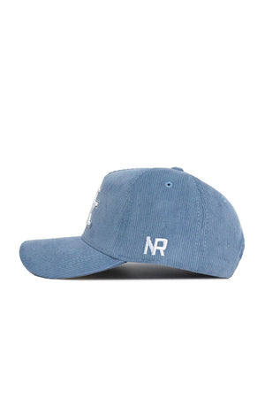 The No Rivals Kentucky Corduroy Hat - Structured in Sky Blue features a side view of this baseball cap with white embroidered NR initials near the back.