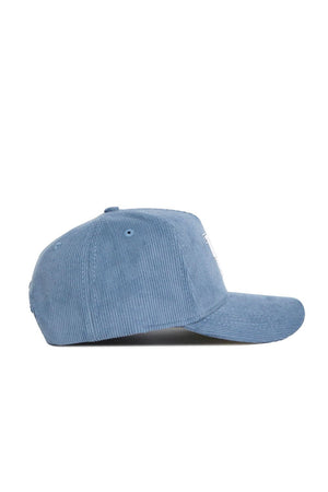 The No Rivals Kentucky Corduroy Hat - Structured - Sky Blue (B2B) is shown from the side on a white background, featuring a curved brim, textured corduroy fabric, and an adjustable snap back closure.