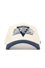 The No Rivals Utah State Triangle Game Cap Hat features a white snapback design with a navy brim, navy triangle and lines on the front, and "UNIVERSITY Utah State" text. Officially licensed for collegiate style and a structured fit.
