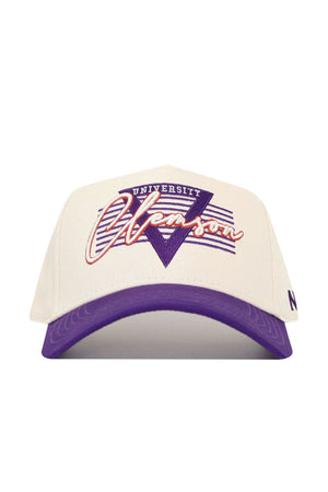 The No Rivals Clemson Triangle Game Cap Hat is a white, structured cotton cap with a purple brim, featuring bold purple and red University Clemson text, a large purple V shape, and purple stripes in the background for standout style.