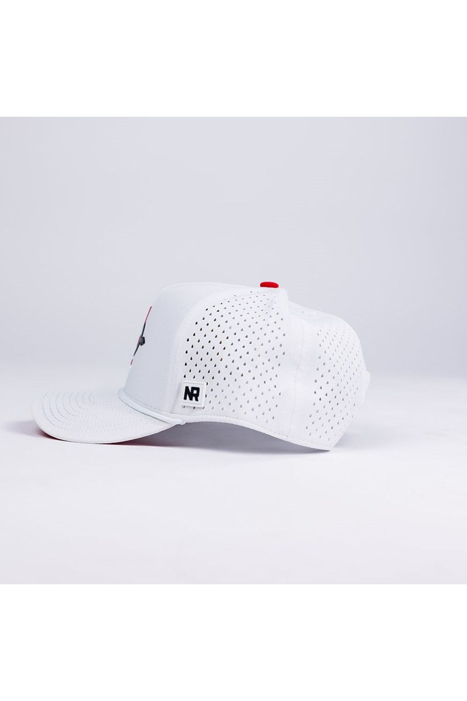 The No Rivals San Diego State Gameday Hat is a white perforated baseball cap with a flat bill, red top button, NR logo patch near the brim, and snapback closure. Shown from the side on a plain, light background.