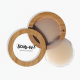 Product shot of Boob-eez Bamboo Compact with 8cm Light tint Headlight Hiders inside and informative insert cards with wear and care instructions, close-up shot showing how to open and close the Bamboo Compact