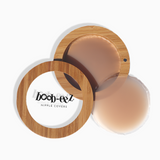 Product shot of Boob-eez Bamboo Compact with 8cm Medium tint Headlight Hiders inside and informative insert cards with wear and care instructions, close-up shot showing how to open and close the Bamboo Compact