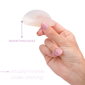 Product shot of hand holding a flexible and reusable Light tint Headlight Hider showing the razor thin edge,  explaining the Headlight Hiders are invisible underneath clothing because of the thin edge 