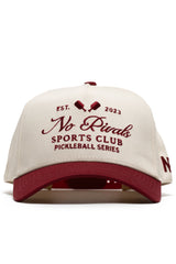 The No Rivals Sports Club Pickleball Hat - Classic Red features a structured snapback design with “Sports Club Pickleball Series Est. 2023” and two pickleball paddles embroidered on the front in premium cotton.