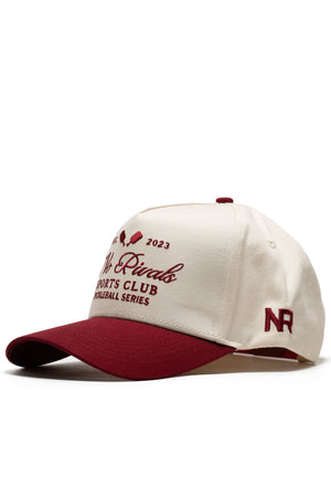 The No Rivals Sports Club Pickleball Hat - Classic Red is a snapback cap in cream and maroon with "2023 Rivals Sports Club Pickleball Series" on the front, NR stitched on the side, and a structured fit with high-quality cotton, maroon visor, and matching top button.