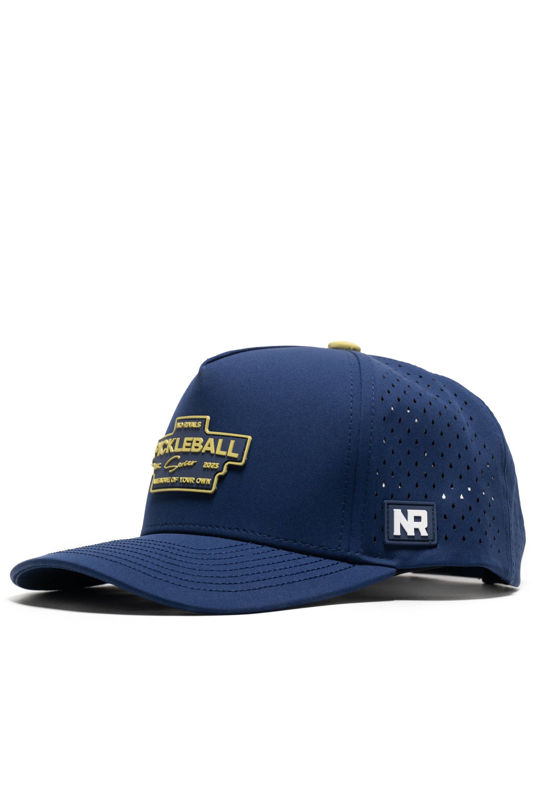 The No Rivals Athletic Pickleball Series Hat - Navy features a yellow pickleball patch, side ventilation holes, a small NR logo by the brim, and a structured snapback design. One size fits most for comfort.